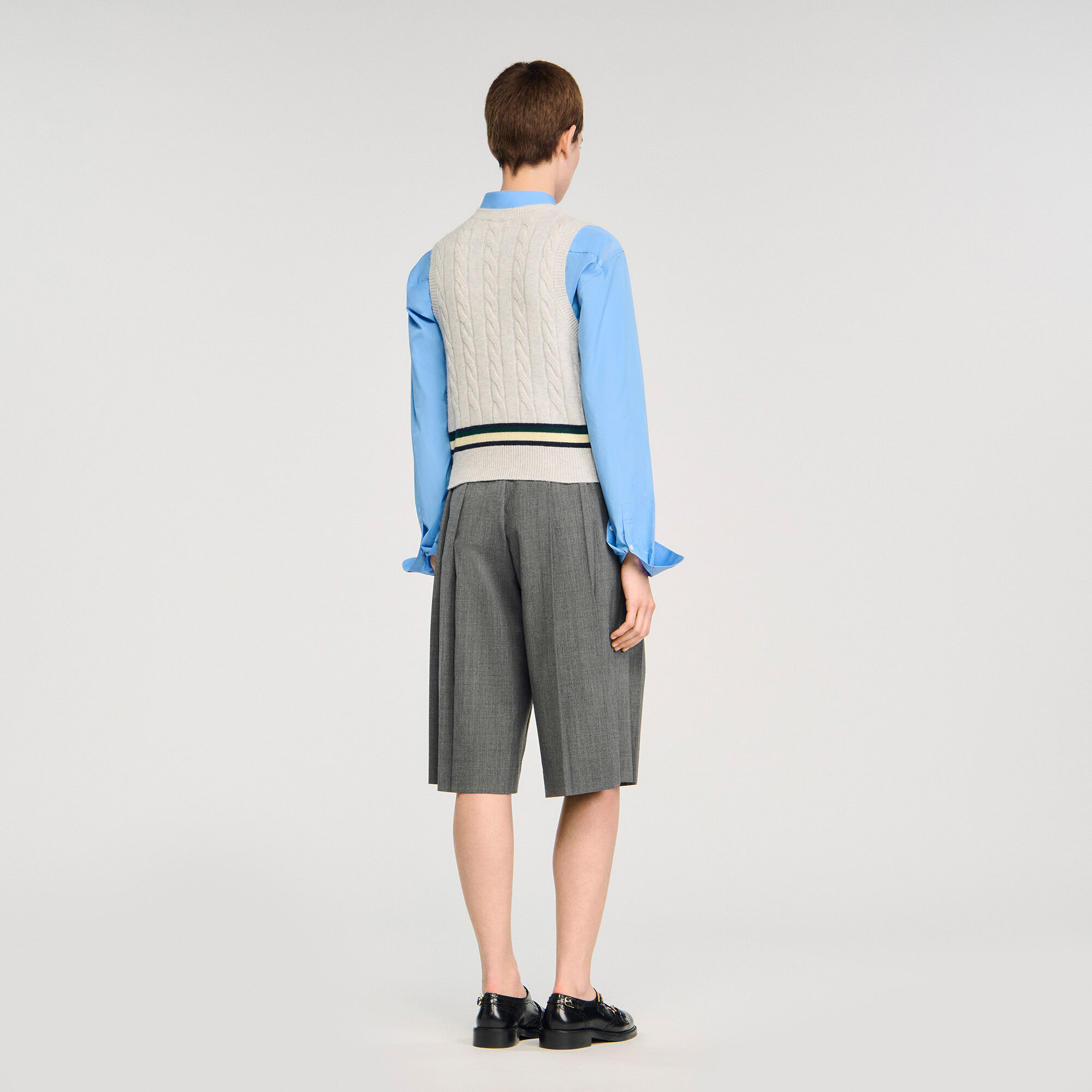 Sleeveless cropped cable knit sweater