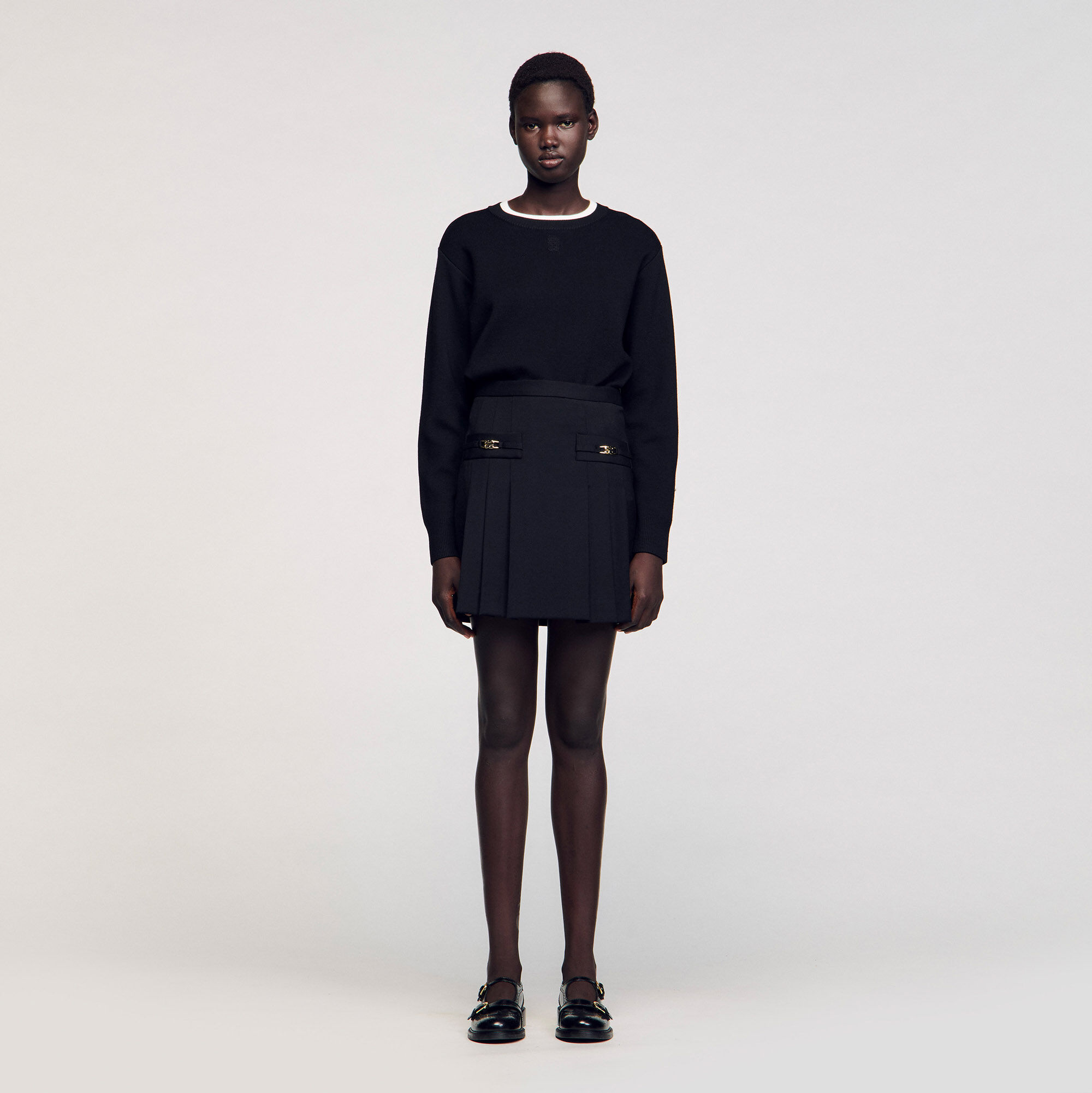 Mini skirt with stitched pleats